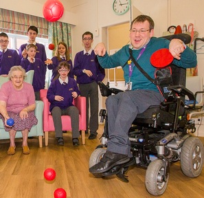 Paralympic coach with cerebral palsy tests care home residents