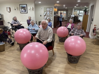 Drumming balls to music - New exercise activity at Bryn Ivor Lodge