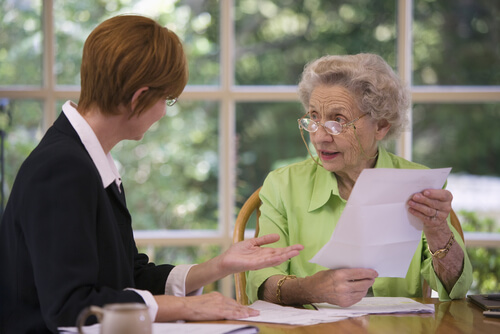 An older lady doing an advanced care plan with a professional